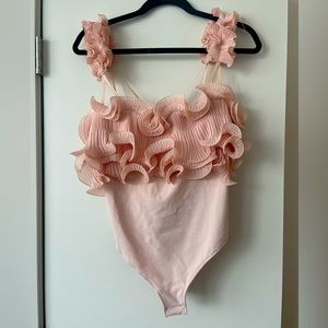 Free People “For the Frill of It” bodysuit.